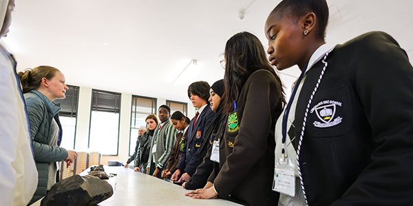 Learners interact with meteorite rocks at Geosciences